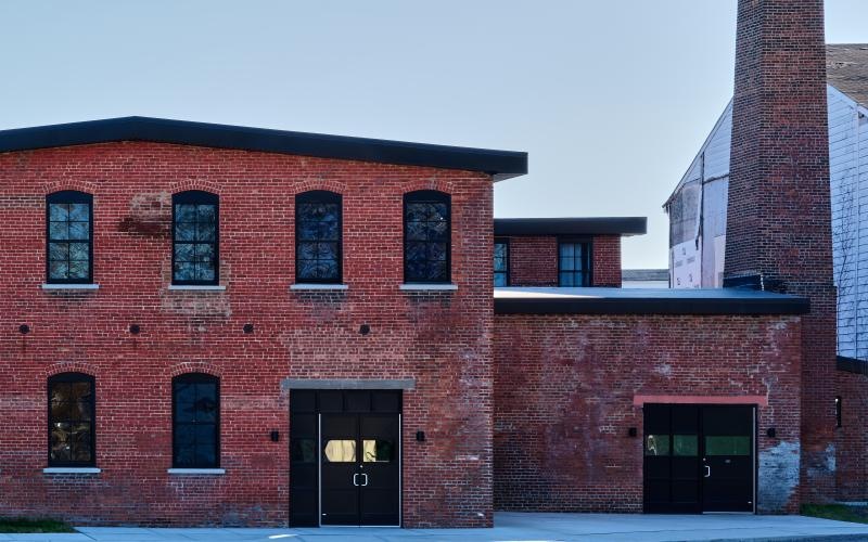 a brick building with a chimney